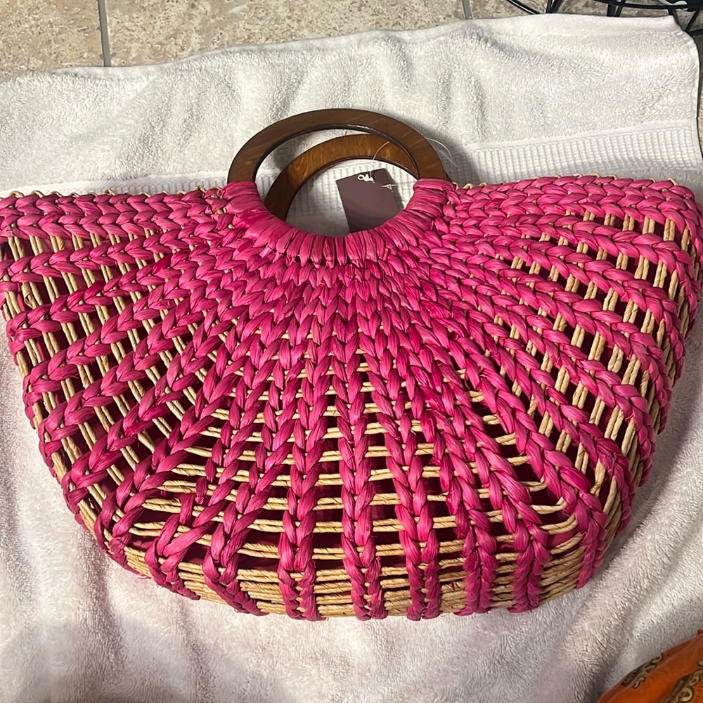 Pink wicker purse with wooden handle